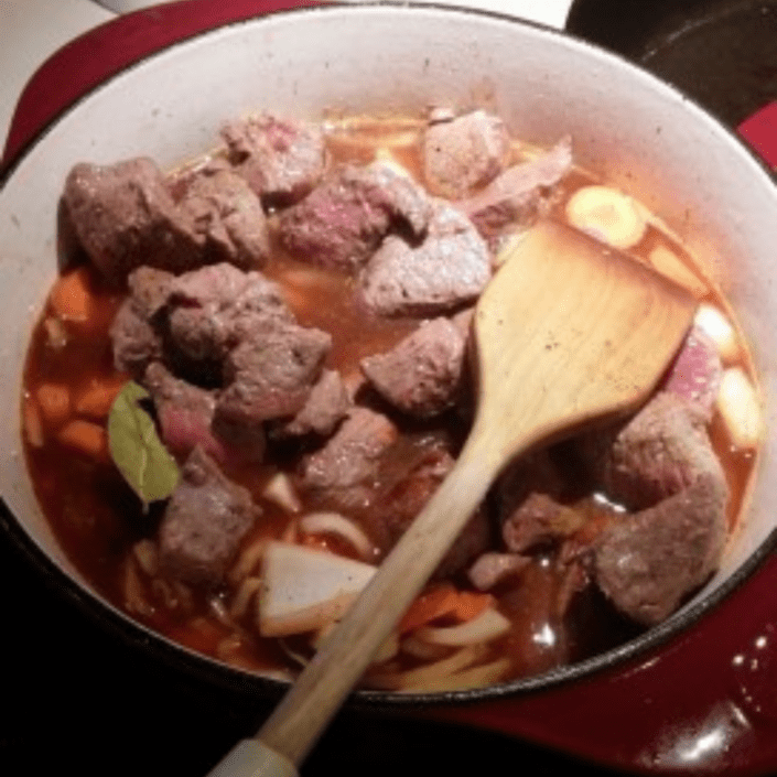 Pot of beef stew on stove.