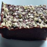 Piece of date-walnut fudge with hemp seeds.