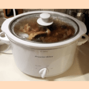 Bone broth in a slow cooker on the counter.