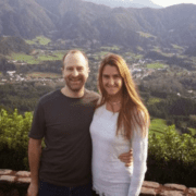 Two people in the Azores with beautiful background scenery.
