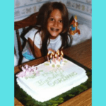 Girl with braces smiling with her birthday cake.