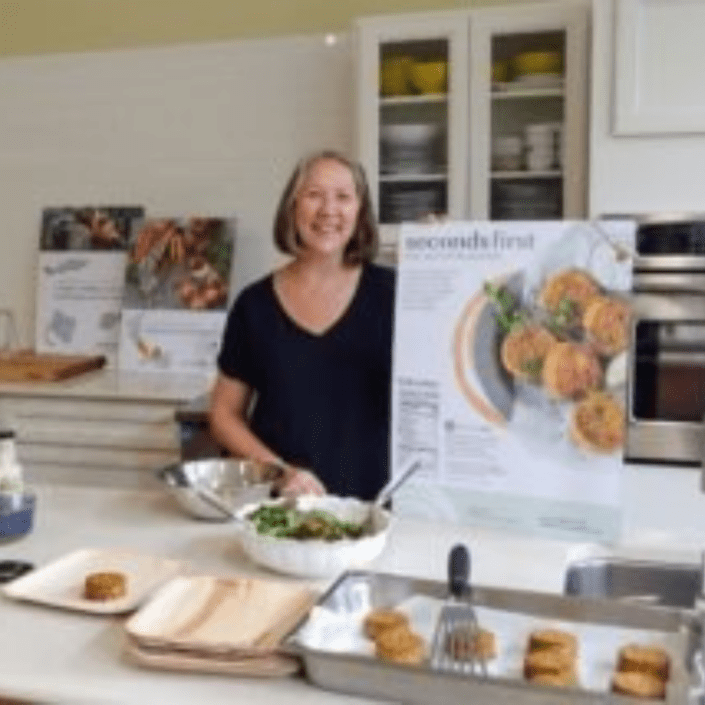Woman making fish cakes.