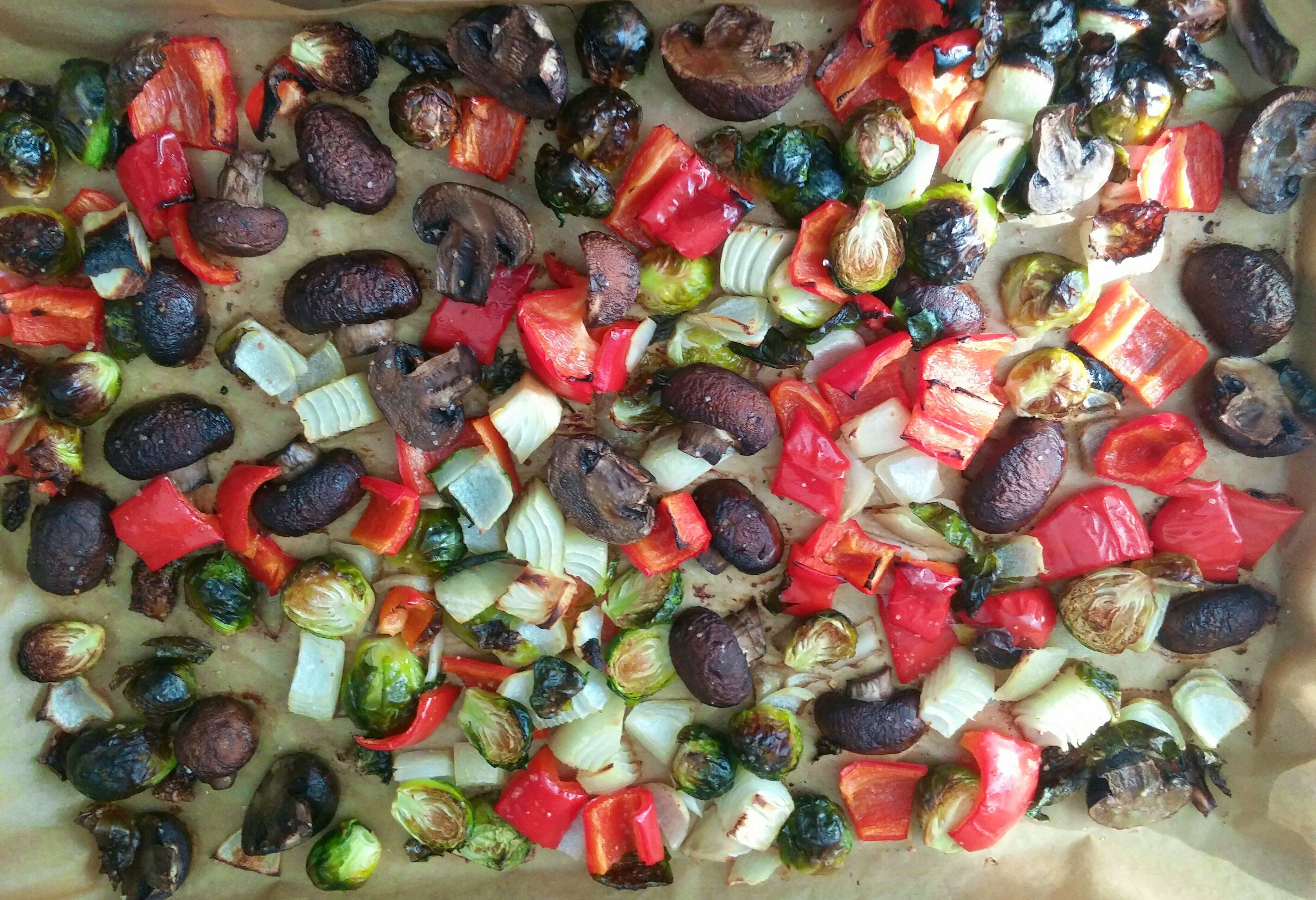 Pan of roasted mushrooms, peppers, onions and brussels sprouts.