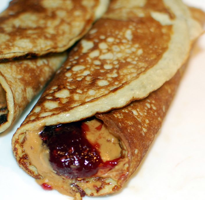 Two egg banana pancake peanut butter and jelly roll up.