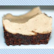 Raw brownie dessert with cashew cream frosting.