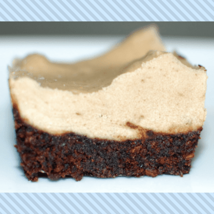 Raw brownie dessert with cashew cream frosting.
