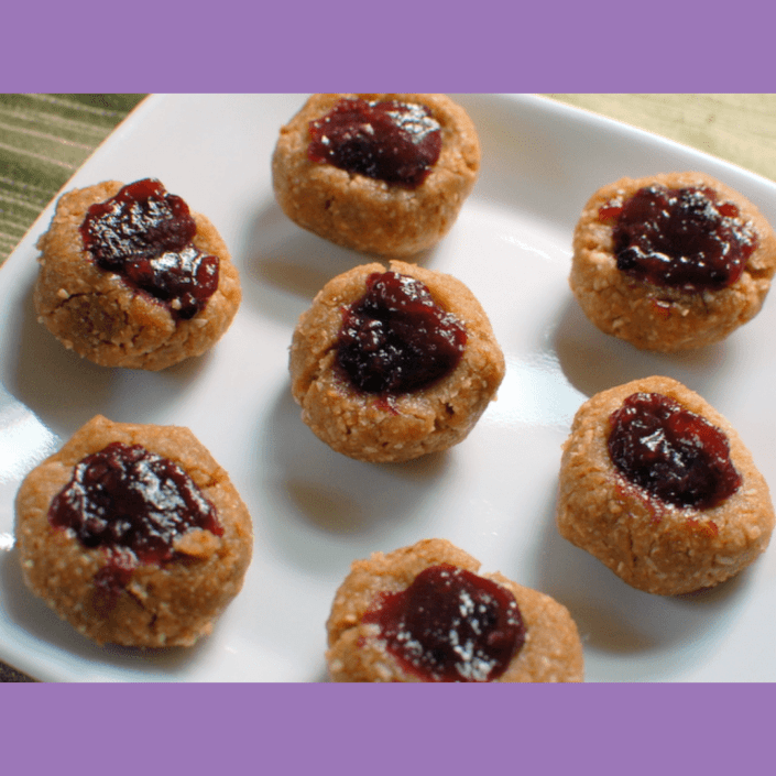 No bake peanut butter oatmeal cookies with jam on top.