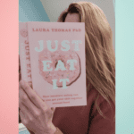Girl reading book called Just Eat It.