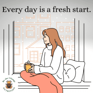 Girl with cup of tea looking out window with the quote: Every day is a fresh start..
